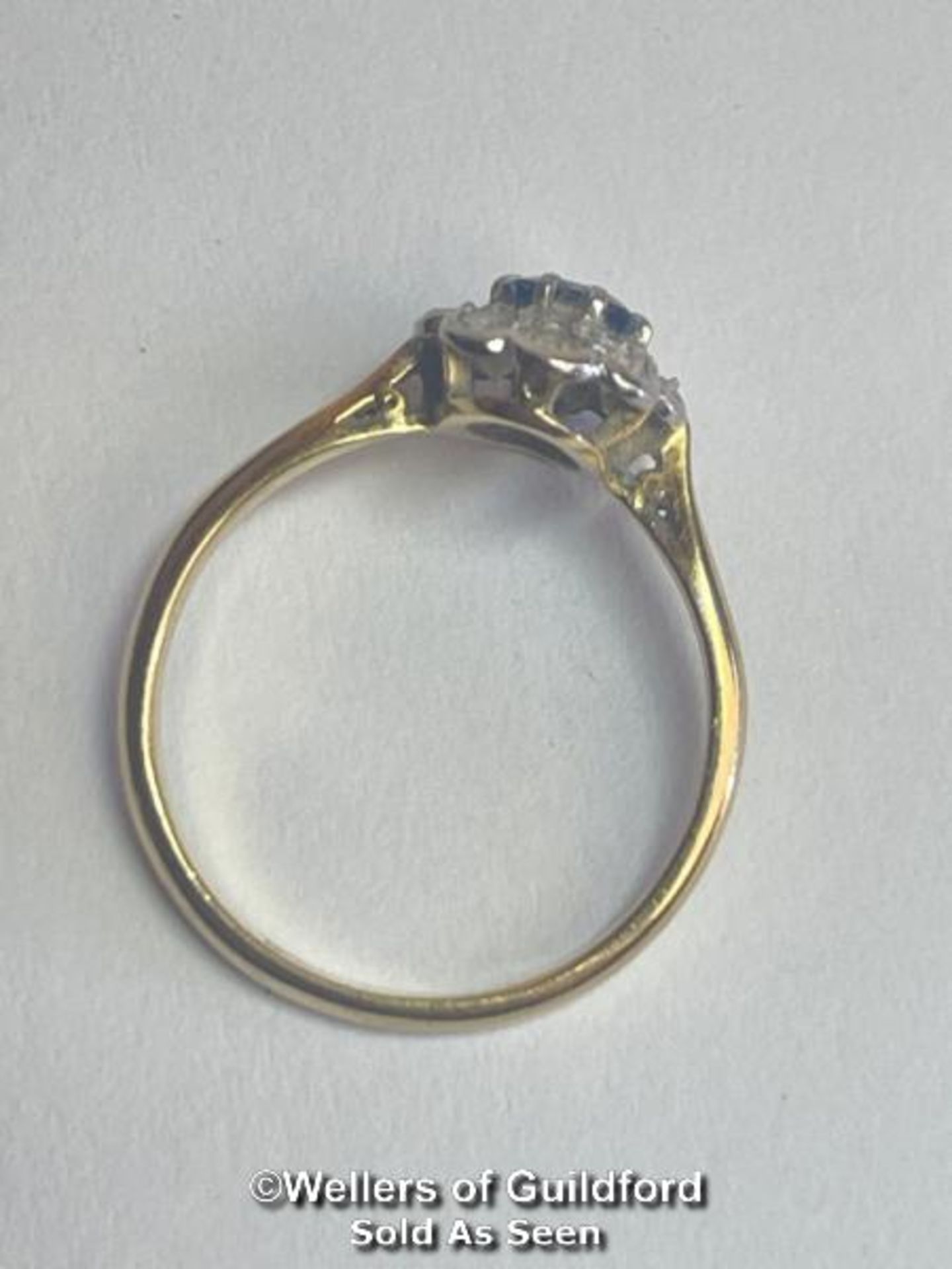 Sapphire and diamond cluster ring. An oval sapphire estimated weight 0.55ct surrounded by ten single - Image 3 of 5