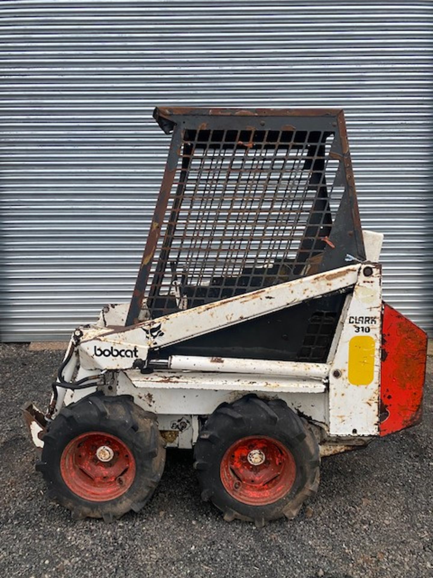 BOBCAT 310 SKID STEER LOADER WITH BUCKET