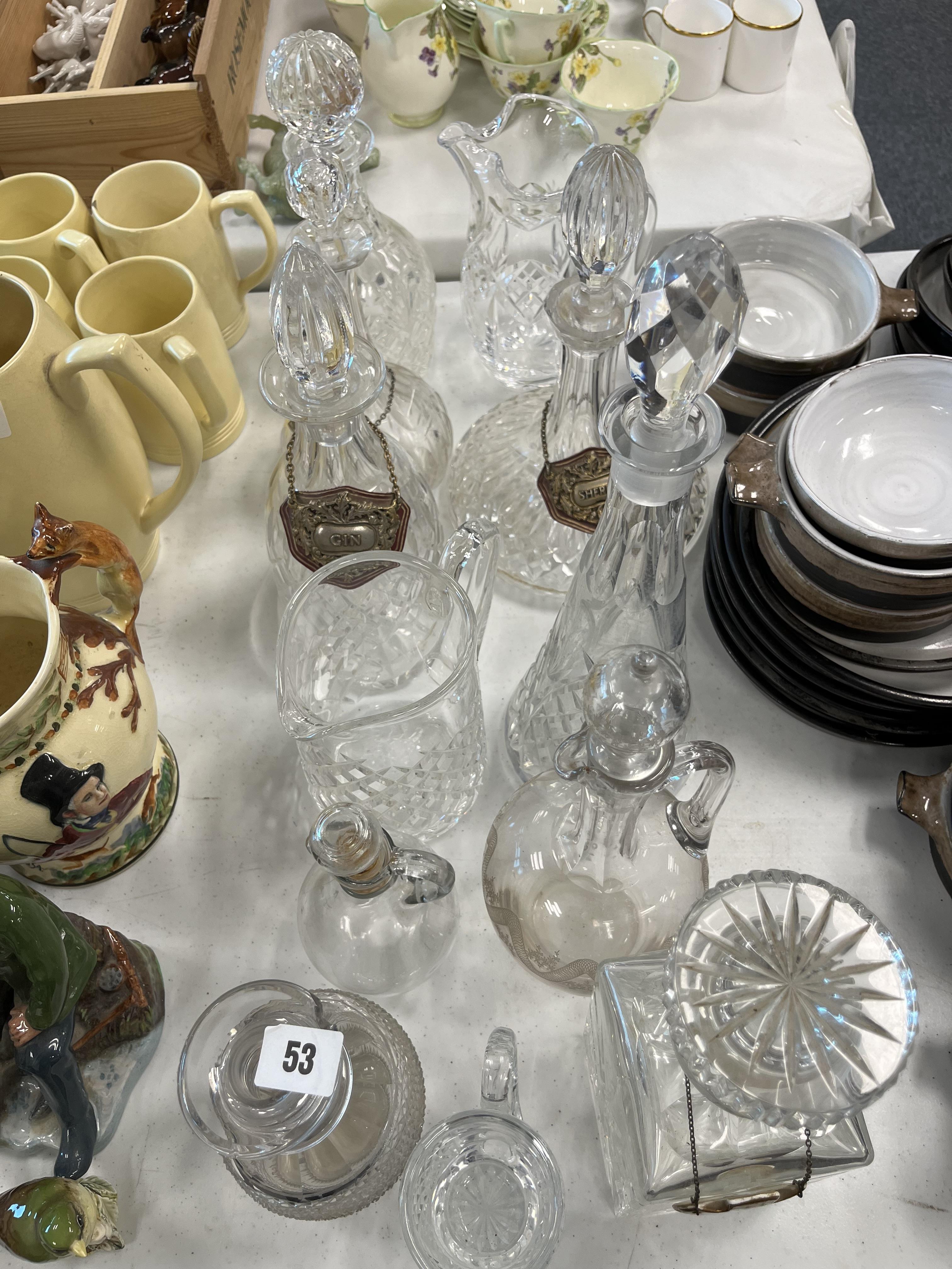 COLLECTION OF CUT GLASS DECANTERS