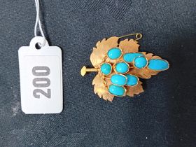 GOLD BROOCH WITH INSET TURQUOISE