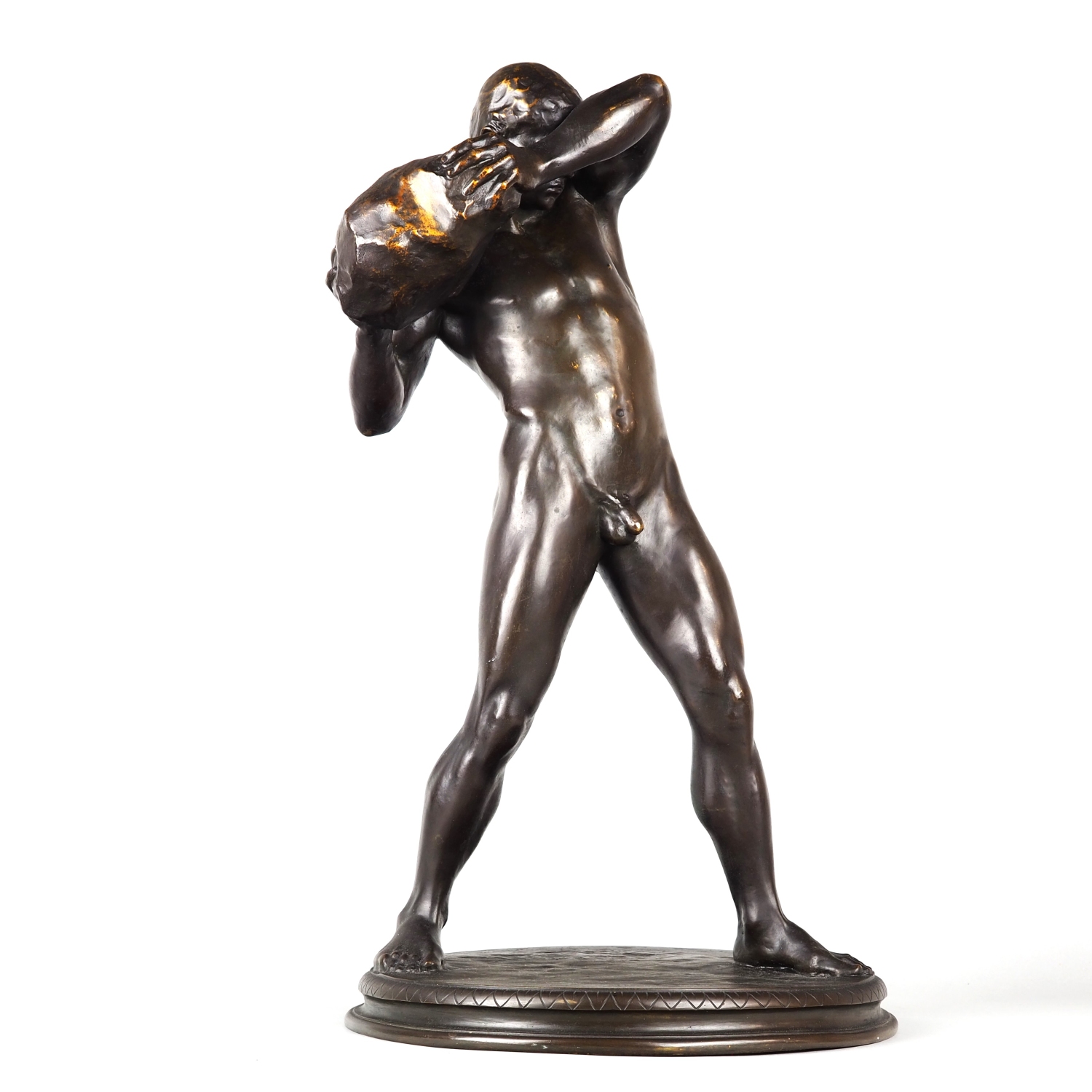 Impressive large bronze of a male naked athlete throwing a huge stone by Paul Moye around 1920