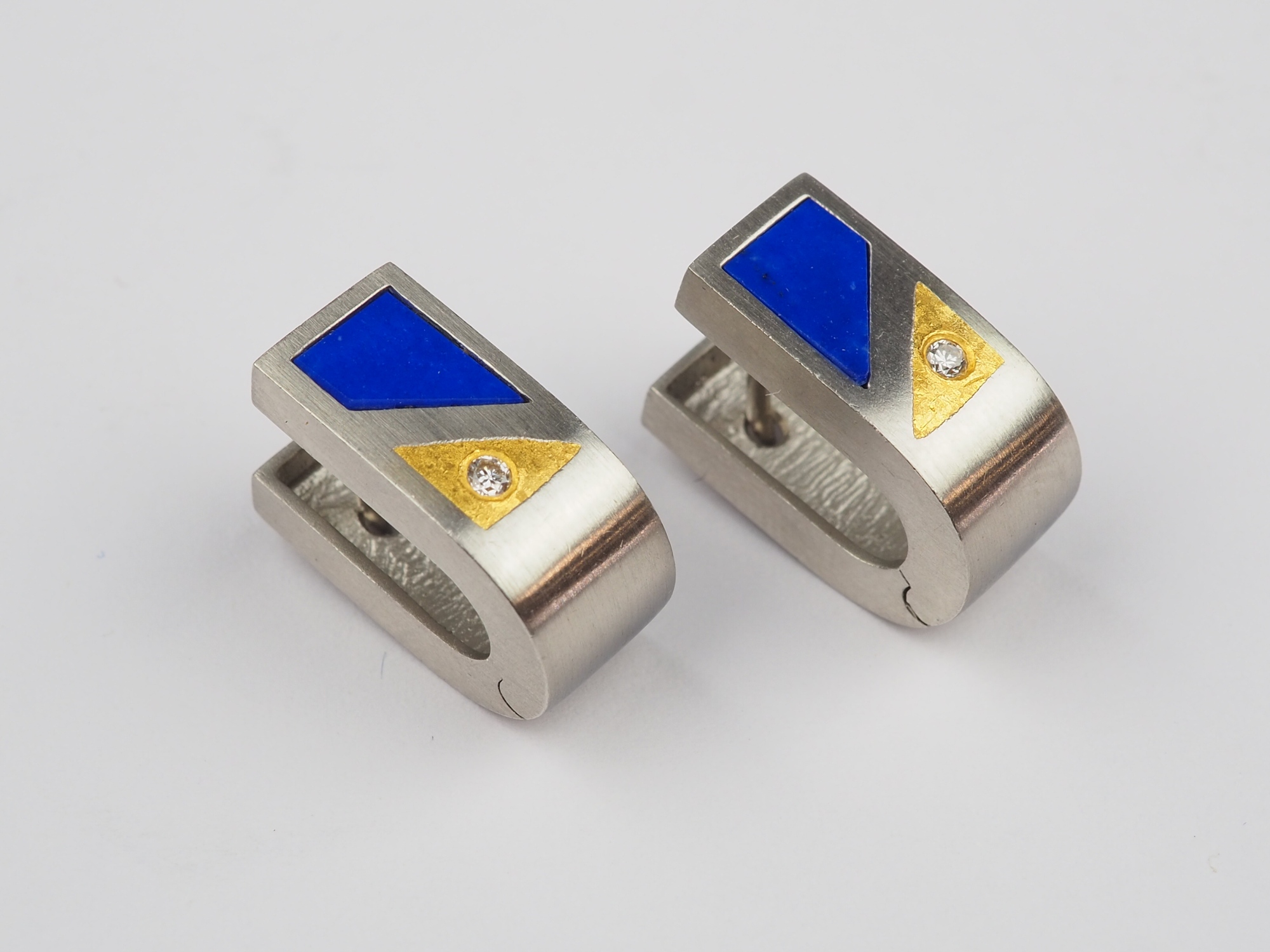 Pair of platinum earrings, with lapis lazuli and small diamond.