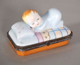 Limoges, pillbox with baby, probably beginning of the 20th century.