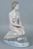 Porcelain figurine: Nymph on a rock