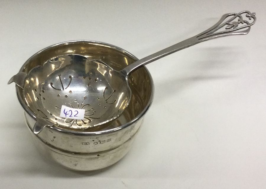 A silver tea strainer on stand. Birmingham1932. By Adie Brothers. Approx. 80 grams. Est. £100 - £ - Image 2 of 2