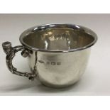 A fine silver christening mug with cast figural handle. Birmingham 1936. By AE Jones. Approx. 99