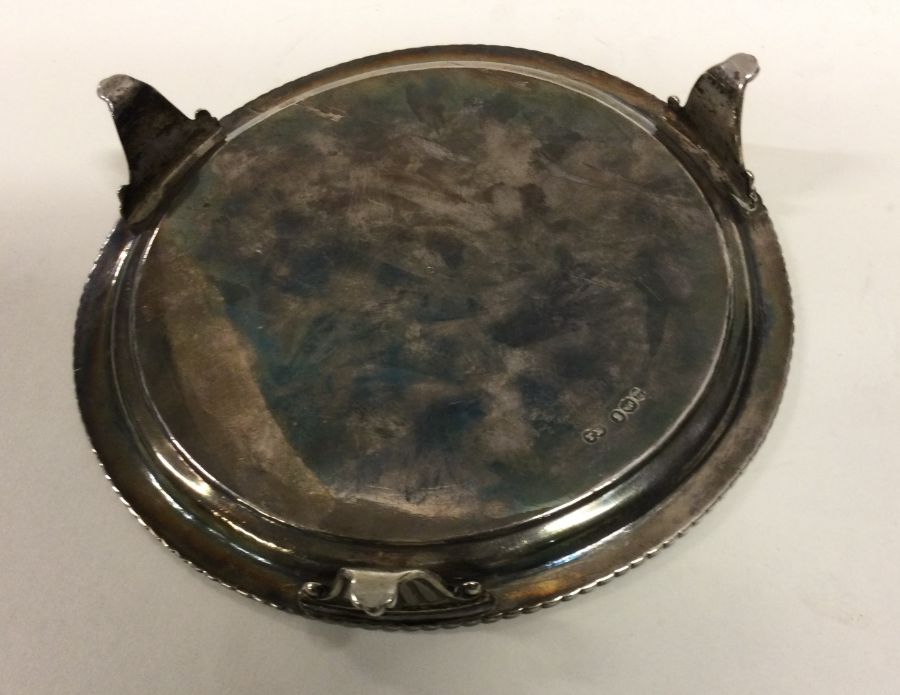 A fine early 19th Century George III circular silver salver. London 1822. By Thomas Burwash. Approx. - Image 2 of 2