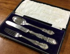 A Victorian three piece silver christening set. London 1898. Approx. 128 grams. Est. £120 - £150.