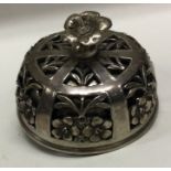 A Continental silver table bell pierced with flowers. Approx. 230 grams. Est. £150 - £200.
