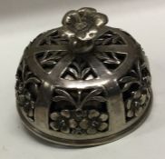 A Continental silver table bell pierced with flowers. Approx. 230 grams. Est. £150 - £200.