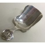 A silver caddy spoon with fluted handle. Birmingham 1918. By Levi and Salaman. Approx. 12 grams.