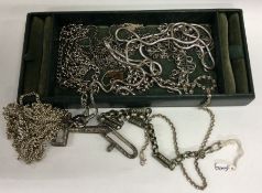 A collection of silver and other mounted chains. E