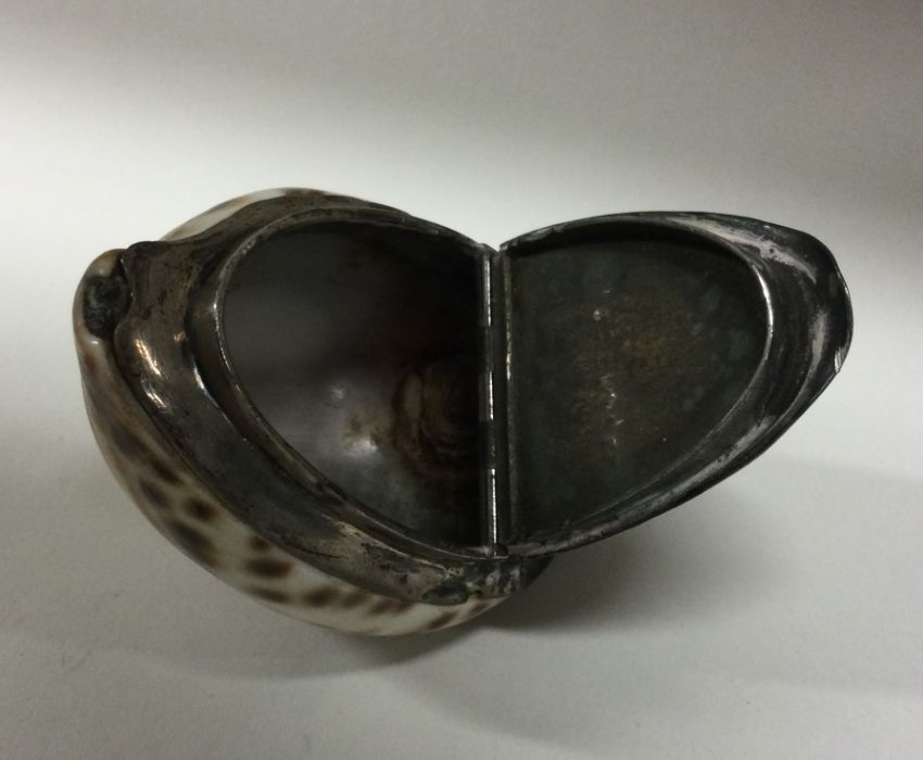 An 18th/19th Century Provincial silver cowrie shell snuff box. Approx. 70 grams. Est. £180 - £220. - Image 2 of 2