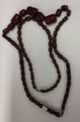 An amber bead necklace together with another bead