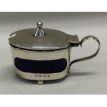 A silver Arts and Crafts mustard pot. Birmingham.