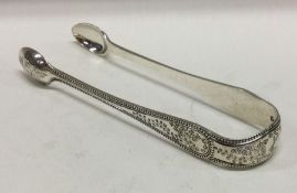 A decorative pair of silver ice tongs. London 1871. By George Adams. Approx.53 grams. Est. £50 - £