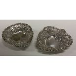 CHESTER: A pair of heart shaped pierced silver dishes with swag decoration. Approx. 37 grams.