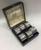 A set of six numbered silver napkin rings. Birmingham 1913. Approx. 130 grams. Est. £200 - £300.