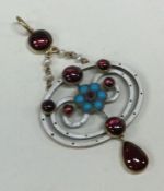 An attractive enamel and cabochon garnet pendant i