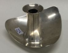 A Modernistic silver chamberstick. London 1957. By Adie Brothers. Approx. 75 grams. Est. £60 - £80.