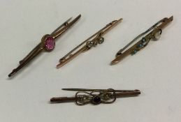 A group of four gold mounted brooches. Approx. 8.4