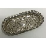 A chased silver dish embossed dish. Birmingham 1903. By William Aitken. Approx. 20 grams. Est. £30 -