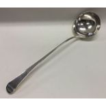 A Georgian silver soup ladle. London. By GJ. Appro