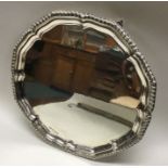 A heavy Georgian style silver salver with gadroon