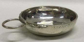A 19th Century French silver wine taster decorated with vines. Approx. 37 grams. Est. £150 - £200.