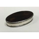 An early 19th Century silver and tortoiseshell hinged snuff box. Approx. 35 grams. Est. £150 - £