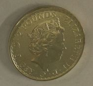 A silver Britannia coin. Approx. 31 grams. Est. £30 - £50.