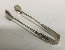 A rare pair of apostle design silver ice tongs. Sheffield 1909. By Walker and Hall. Approx. 24