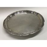 A Chinese silver salver chased with flowers to border. Circa 1880. By Wang Hing. Approx. 194