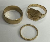 A group of three 9 carat wedding rings. Approx. 8.