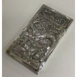 A Chinese silver card cased chased with bamboo and temples to pull off lid. Approx. 30 grams.
