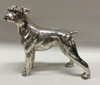 A Sterling silver figure of a hound dog. Marked to body. Approx. 270 grams. Est. £100 - £150.