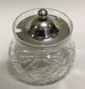 A fine silver mounted glass honey jar. Sheffield 1942. By Francis Howard Ltd. Est. £50 - £80.