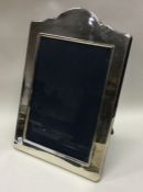 A large silver photo frame. London 1991. By Mappin and Webb. Est. £180 - £220.