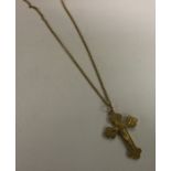 A 9 carat cross on fine link chain. Approx. 4.5 gr