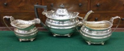 CHESTER: A heavy silver three piece tea set on bal