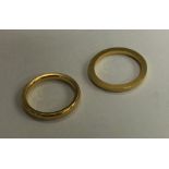 Two 22 carat gold wedding bands. Approx. 7.2 grams