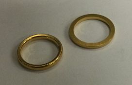 Two 22 carat gold wedding bands. Approx. 7.2 grams