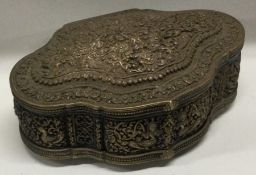 A heavy Eastern silver hinged top box with chased