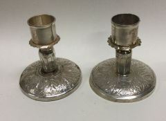 A heavy pair of Continental silver candlesticks. Approx. 800 grams gross weight. Est. £50 - £80.