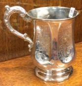 A Victorian silver christening mug with engraved decoration. London 1851. By William Pope. Approx.