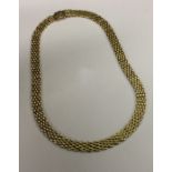 A 9 carat fancy link necklace with concealed clasp