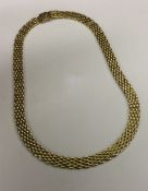 A 9 carat fancy link necklace with concealed clasp