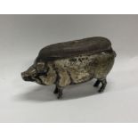 A large silver pin cushion in the form of a pig. A