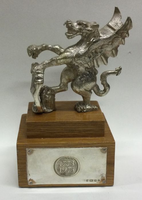 A rare silver cast model of the ‘Queen’s Beast’ on wooden base. London 1973. Approx. 377 grams gross