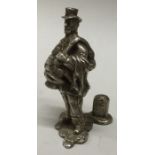 A silver figure of a Charles Dickens character. Approx. 52 grams. Est. £30 - £50.